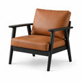 Gepolsterter Retro-Sessel aus braunem Kunstleder mit schwarzem Holzgestell, 75 × 80 × 85 cm